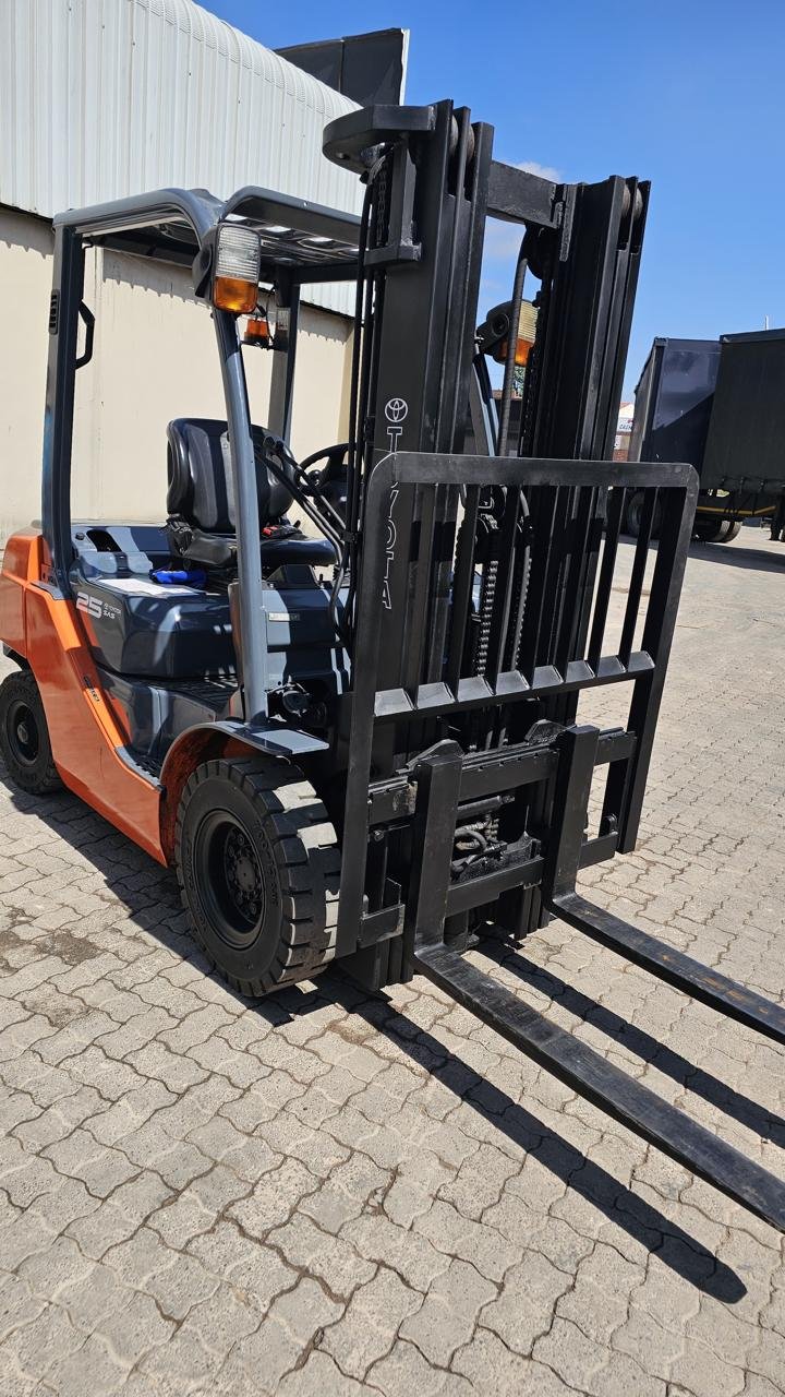 Toyota forklift mast and forks, close-up view.